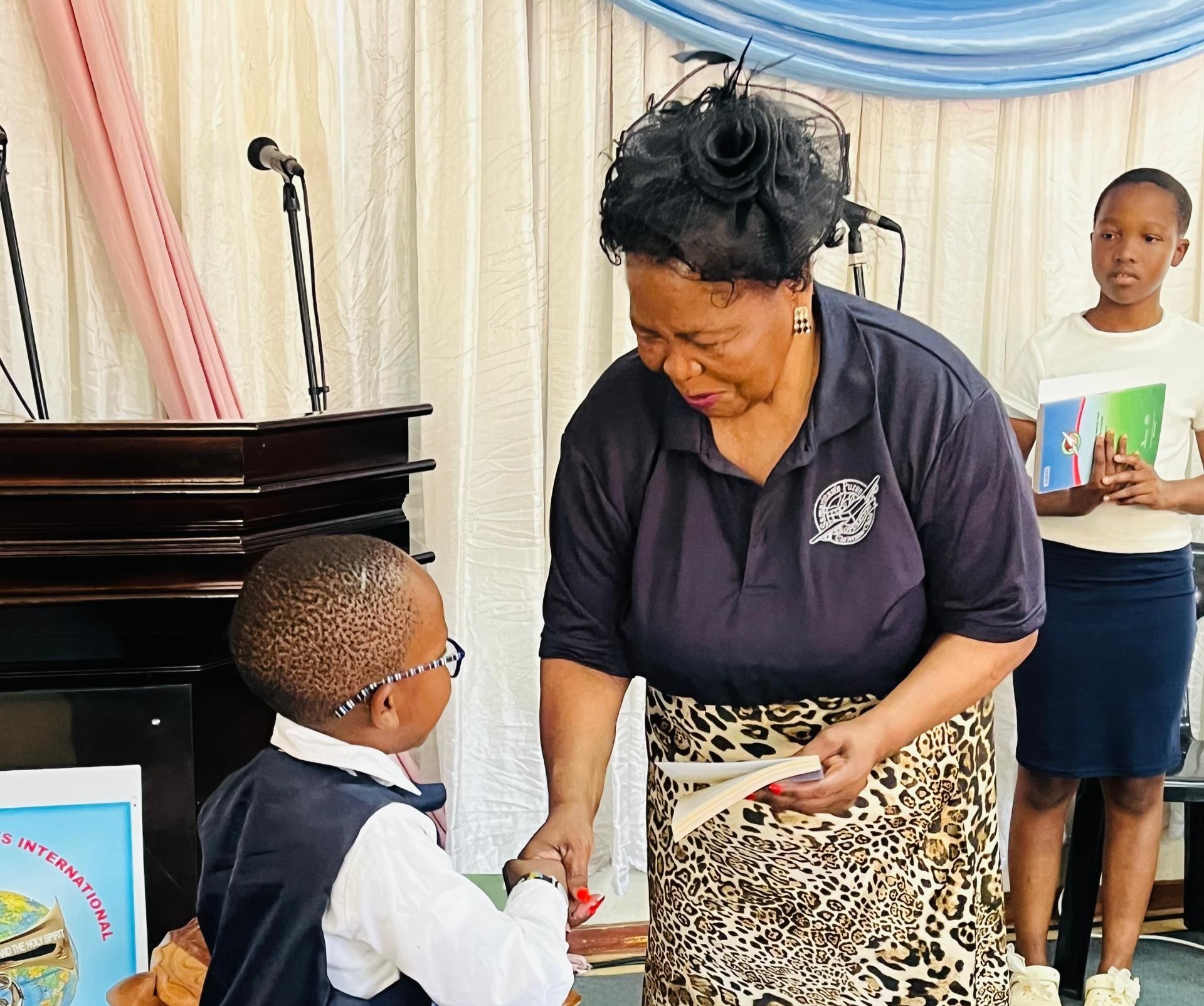 Aunt B presenting certificate